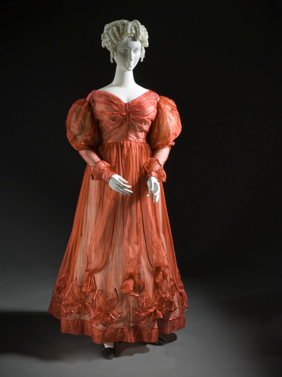 Ball gown with illusion lace back panel over sheer foundation.