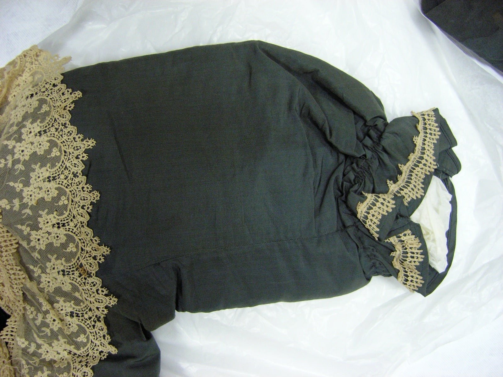 Evening dress with inset lace panel set into bodice opening.
