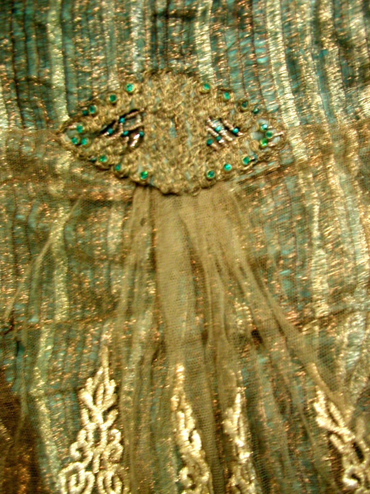 Dress with keyhole back opening at upper bodice panel.