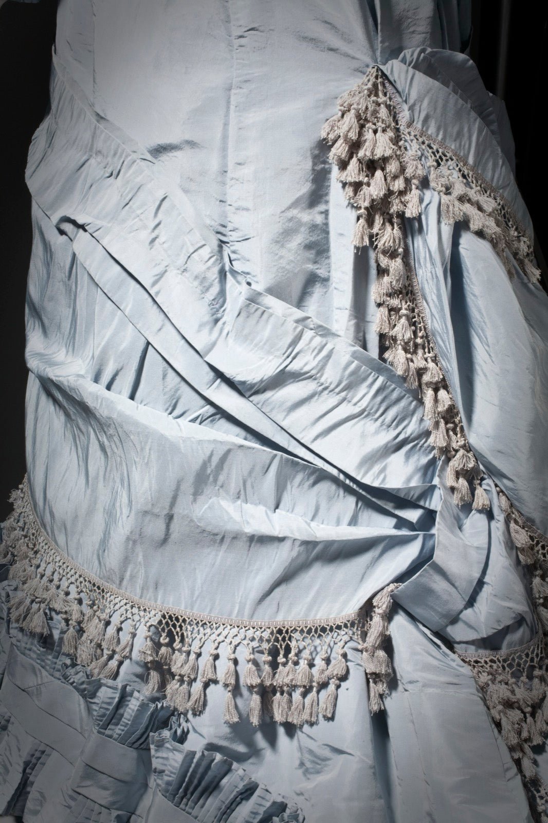 Historic woman's dress from LACMA showing shaped neckline at the upper chest.