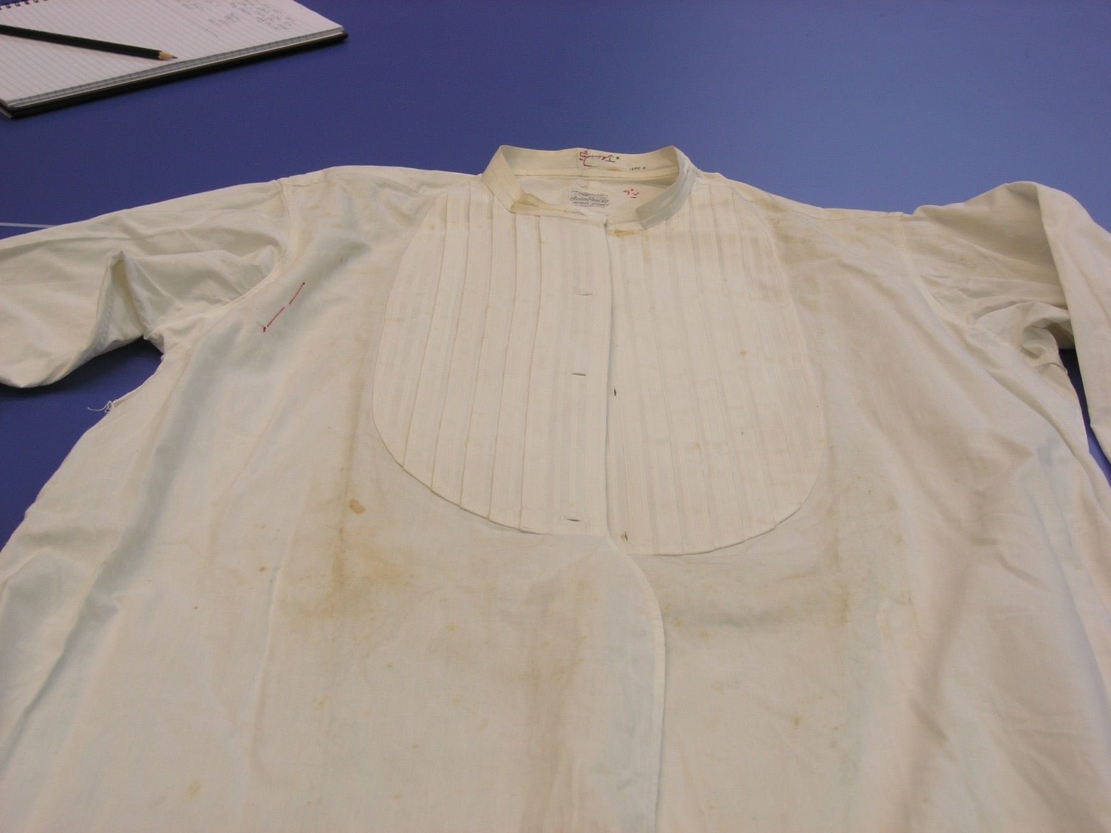 Dress shirt with full-length long sleeves ending at the wrist cuff.