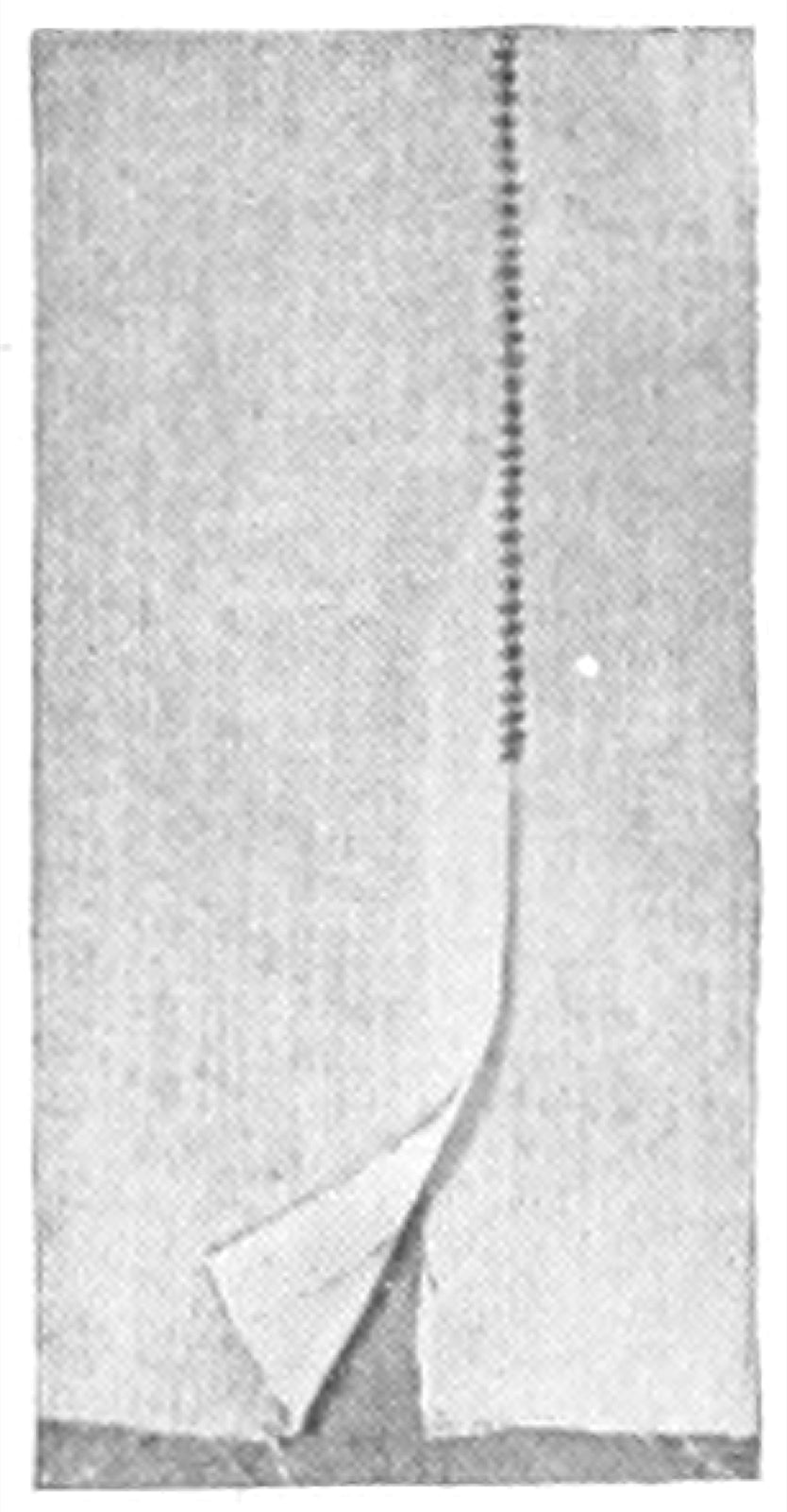 Machine hemstitching used as a seam finish on garment edge.