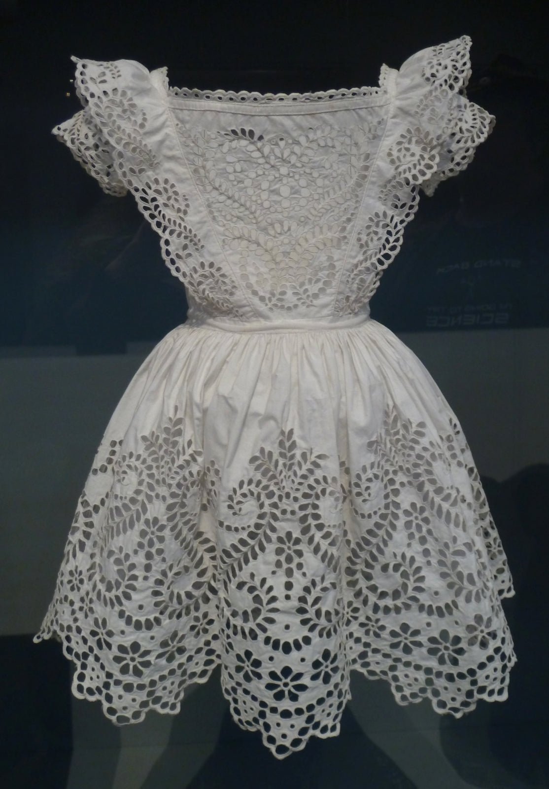Silver thread reference photograph on textile or garment surface.