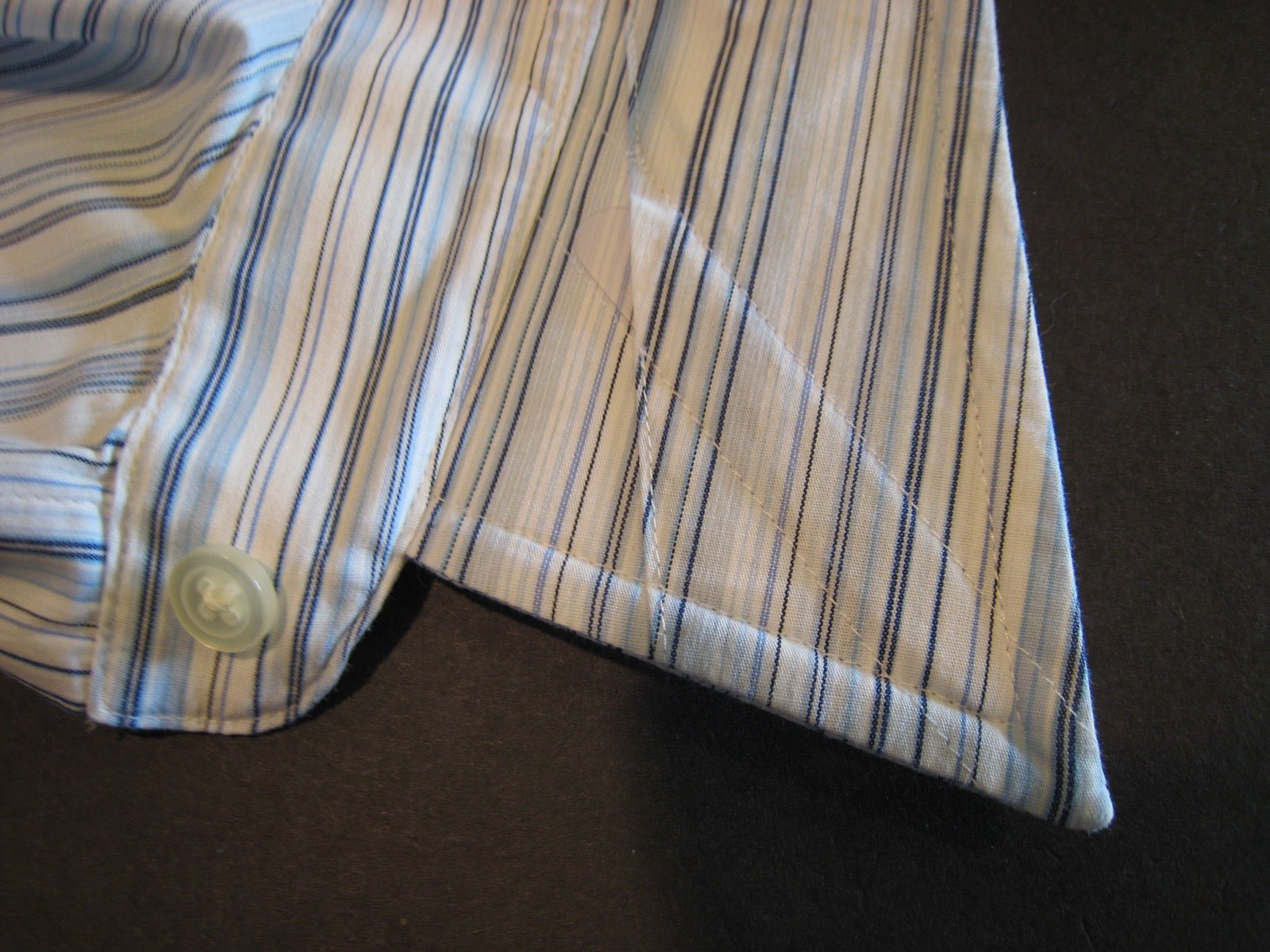 Plastic collar stay insert stiffening shirt collar point panel.
