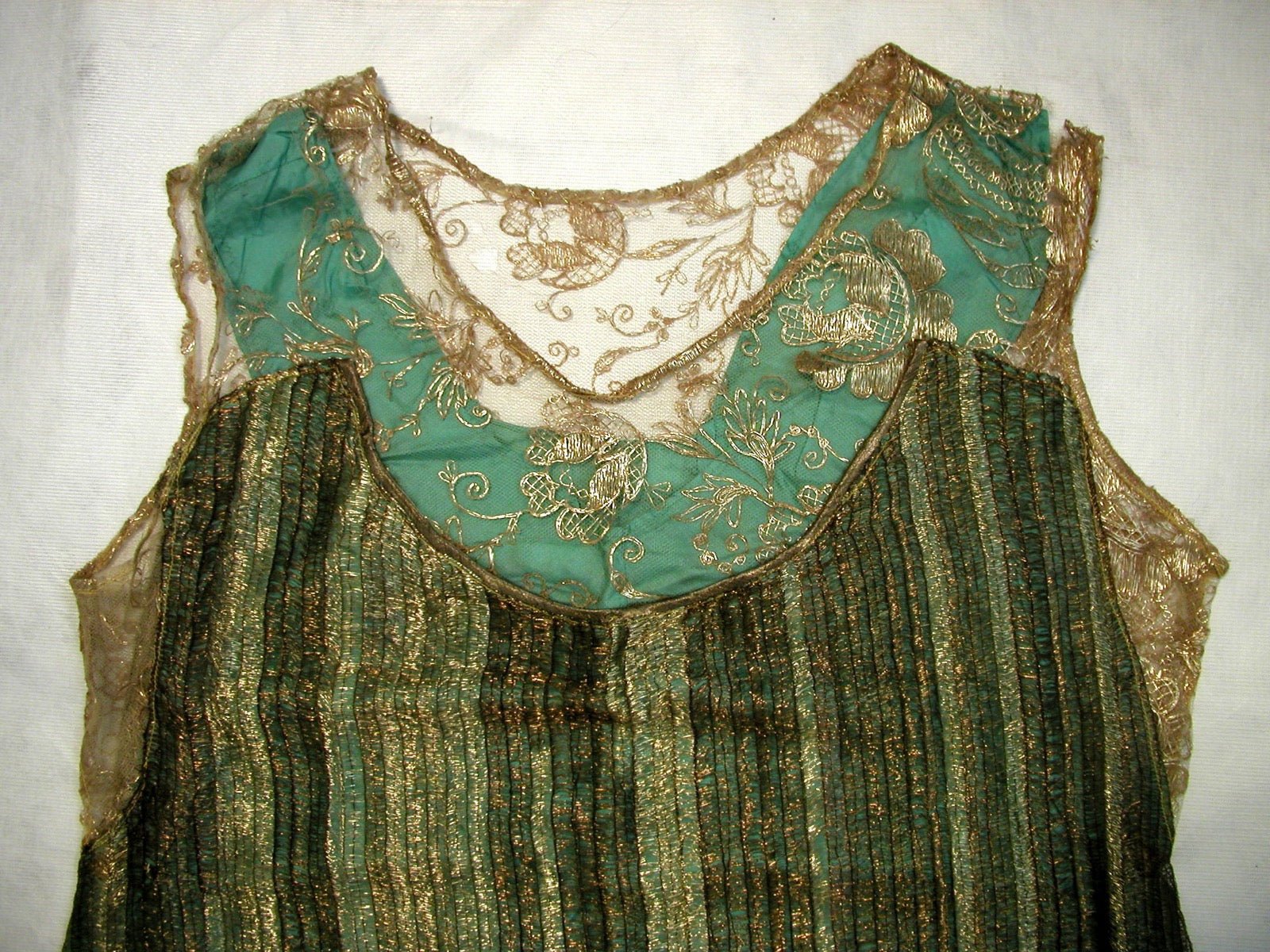 Evening dress with open back panel exposing shoulder blades.