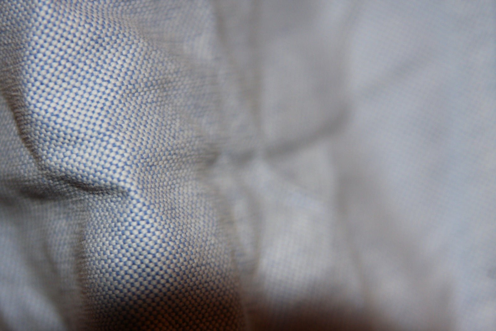 Oxford basket-weave cotton shirting showing paired warp texture.