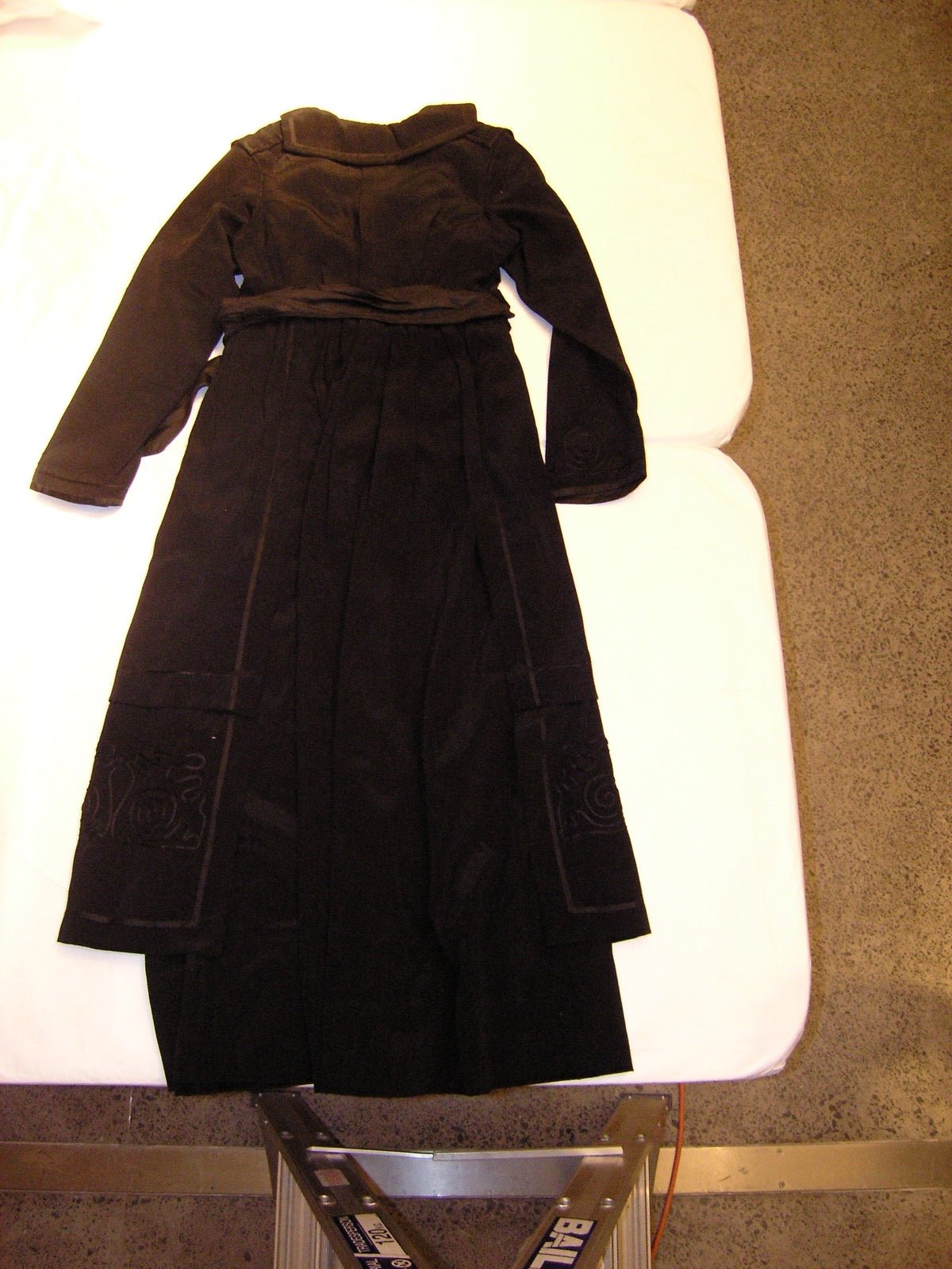 Panel seam joining dress bodice and skirt sections.