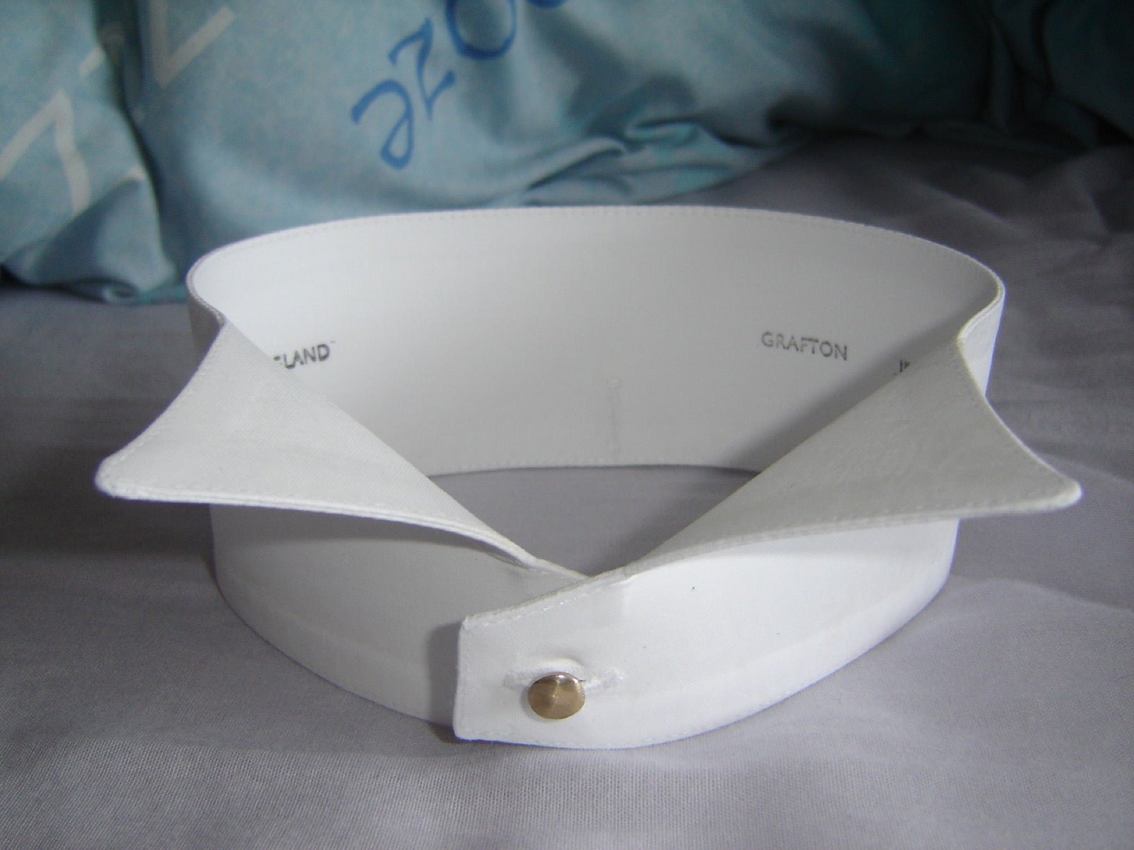 Stiff starched wing collar with high points—the Piccadilly collar trade style.