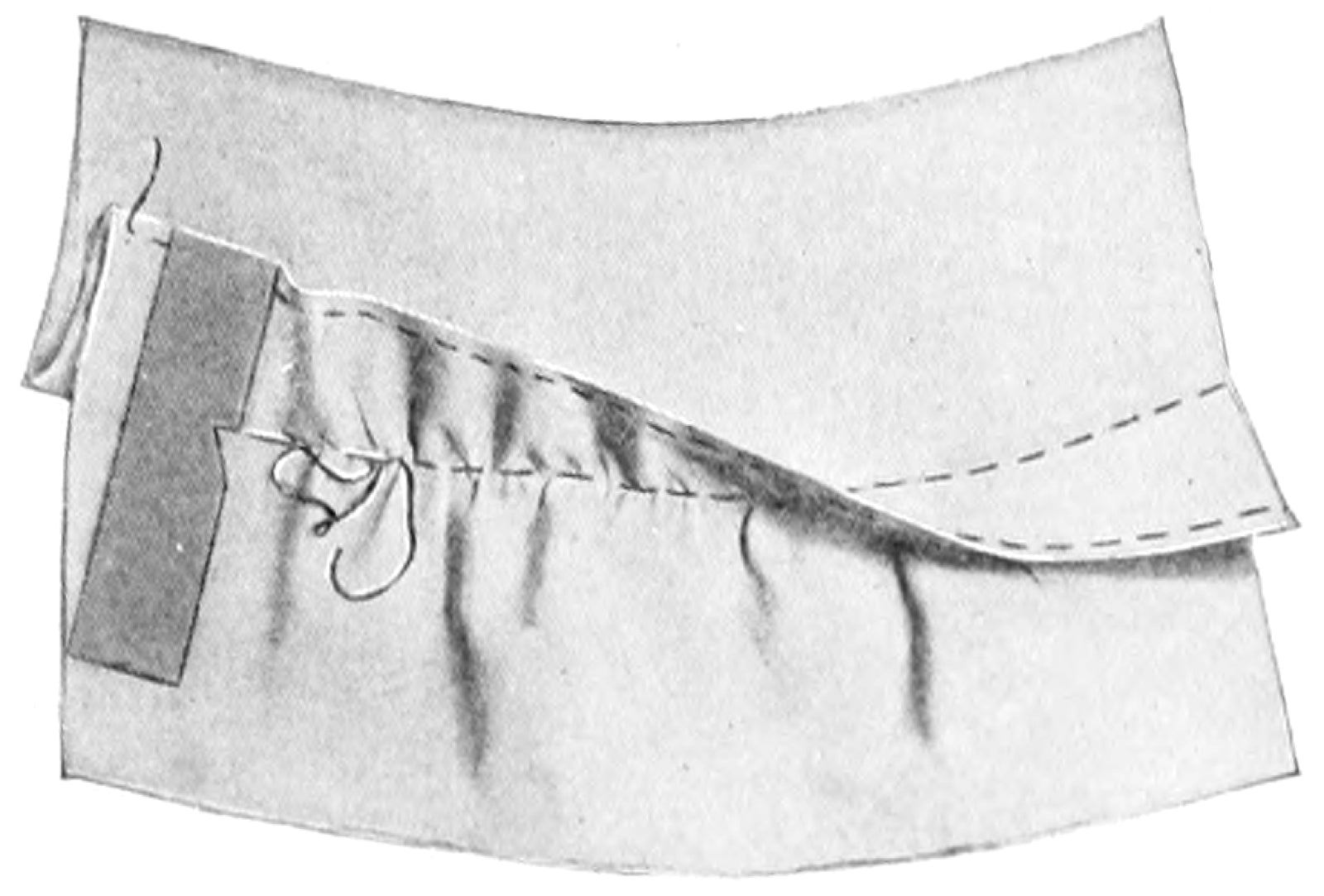 Curved pin tuck rows pressed on blouse front panel.