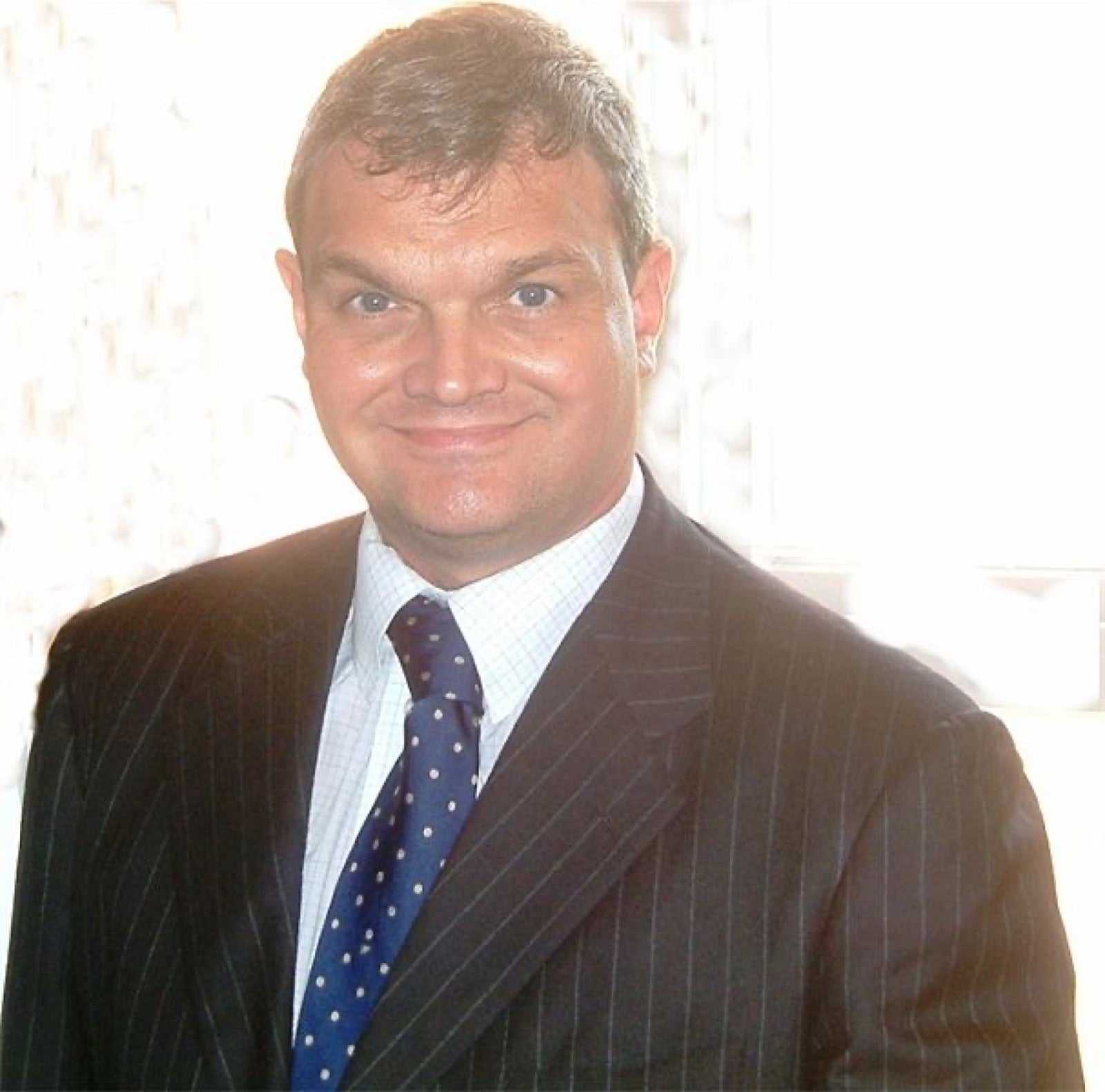 Pinstripe suit showing narrow parallel stripes in worsted wool.