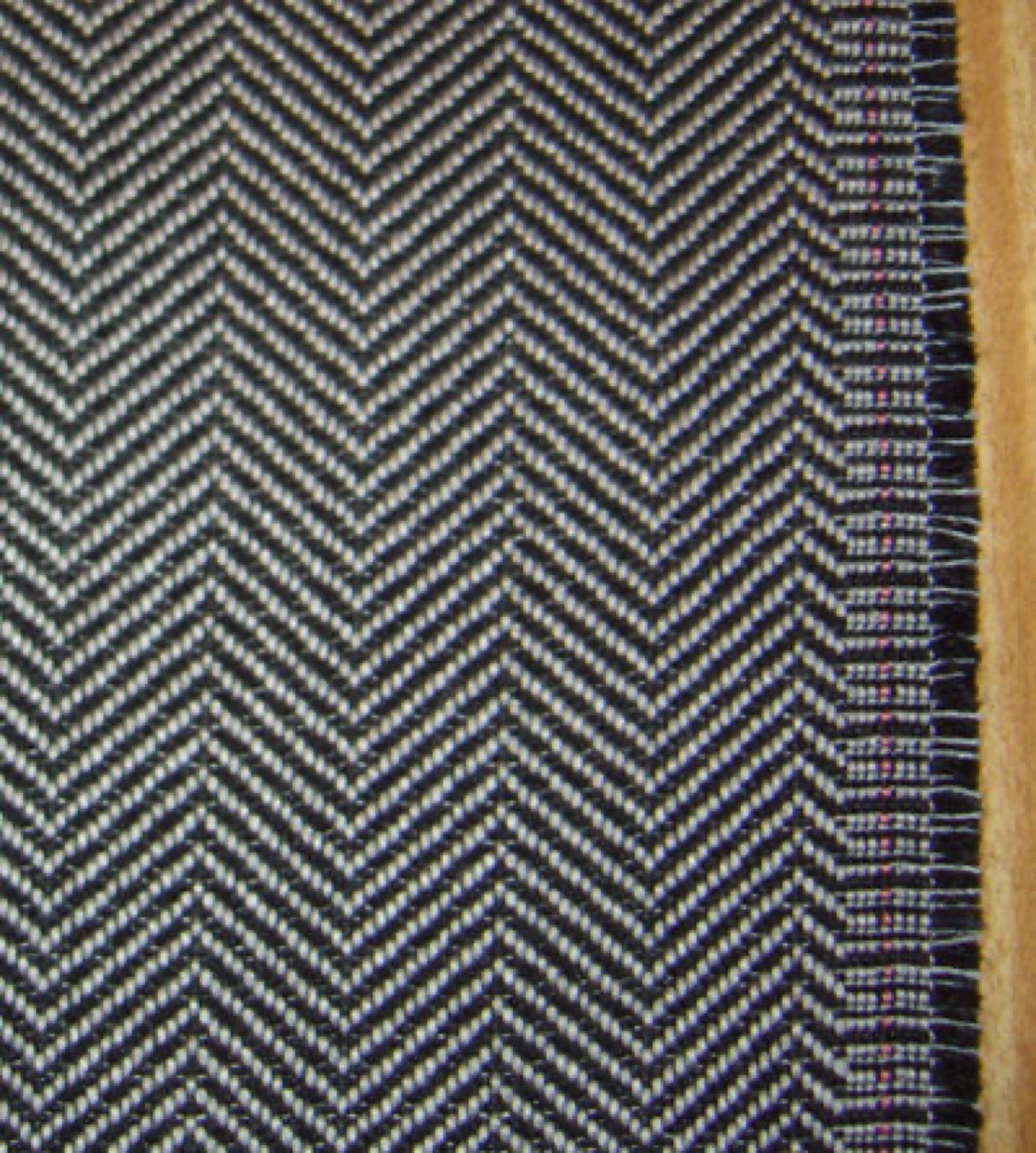 Herringbone diagram showing twill ribs reversing direction in chevrons.