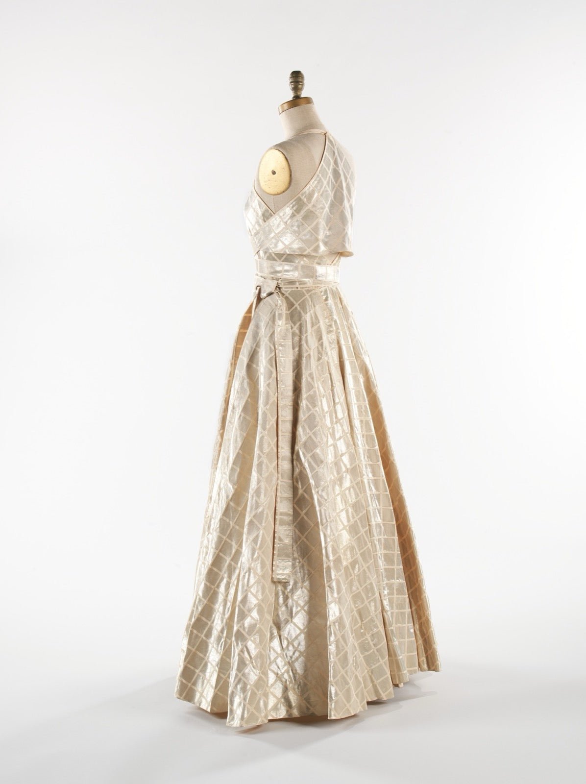 Evening dress with scoop back neckline curving across shoulder blades.