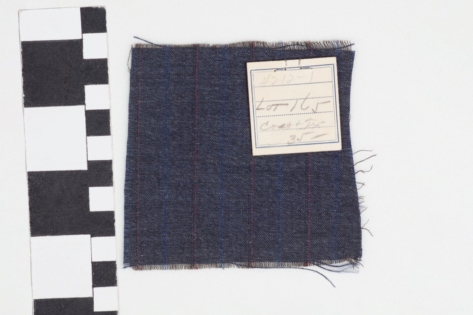 Historic suiting fabric swatches including tonal shadow stripe patterns.