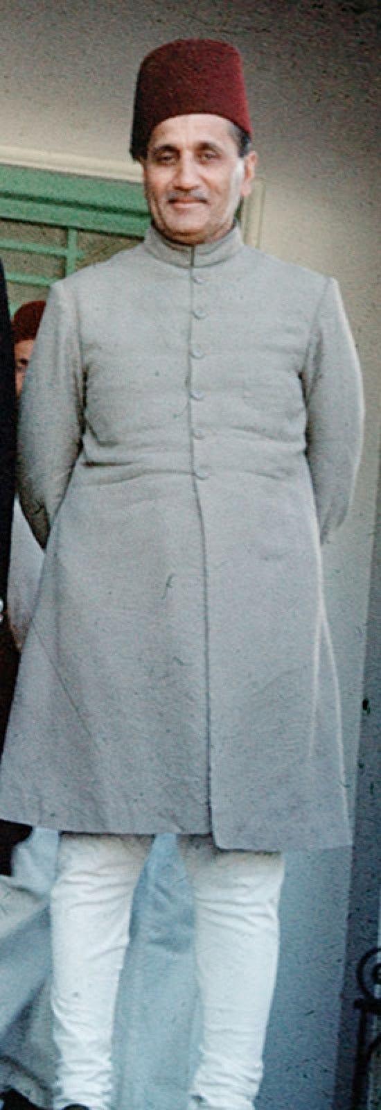 Formal sherwani with structured front panel and standing collar.