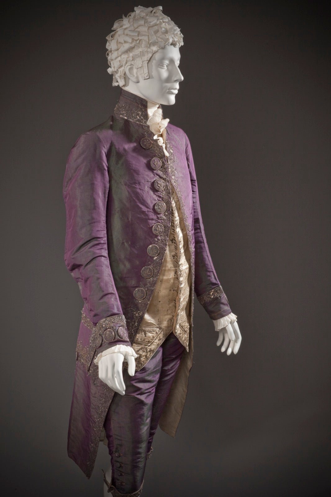 Historic man's shot silk suit showing iridescent color shift.