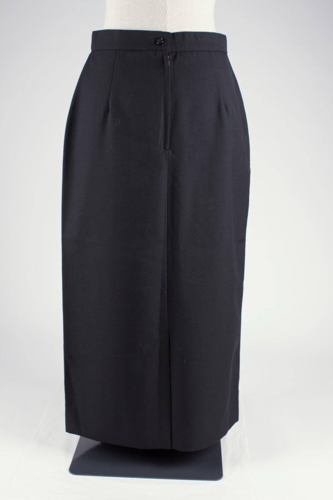 Formal skirt with side vent opening at hem panel.