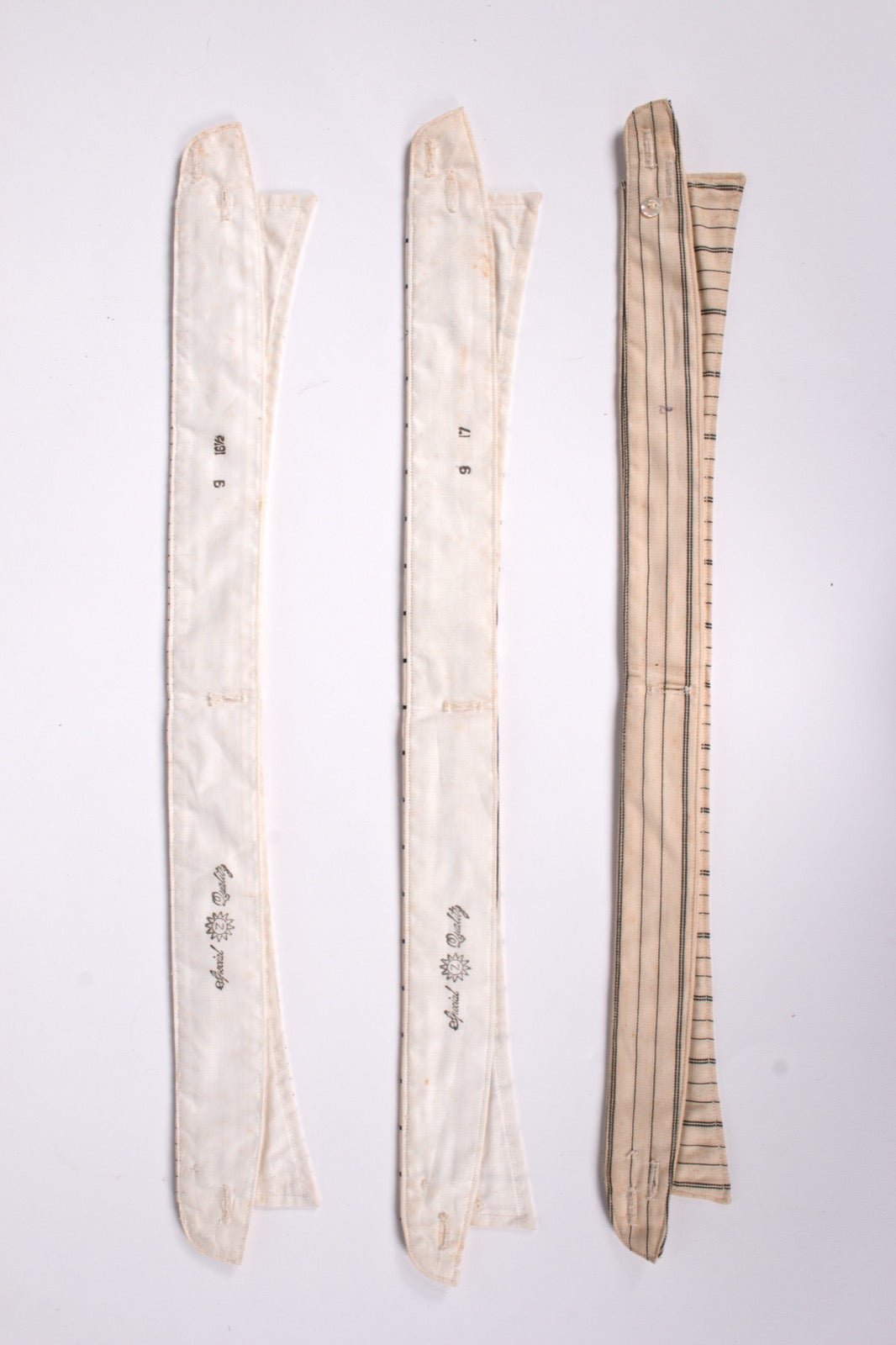 Museum dress shirt displayed with detachable collars including tab collar.