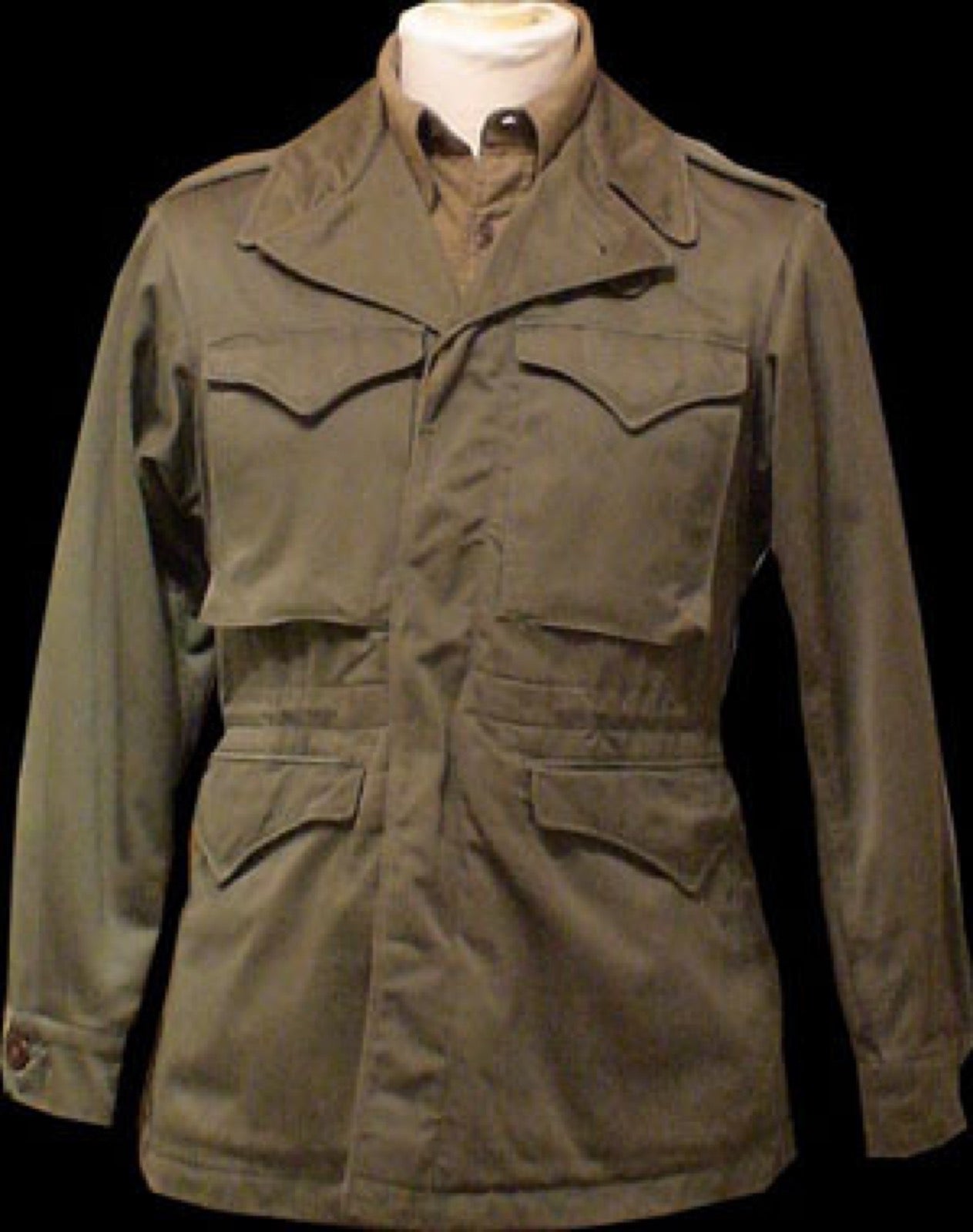 M1943 field jacket with small ticket pocket above hip patch pocket.