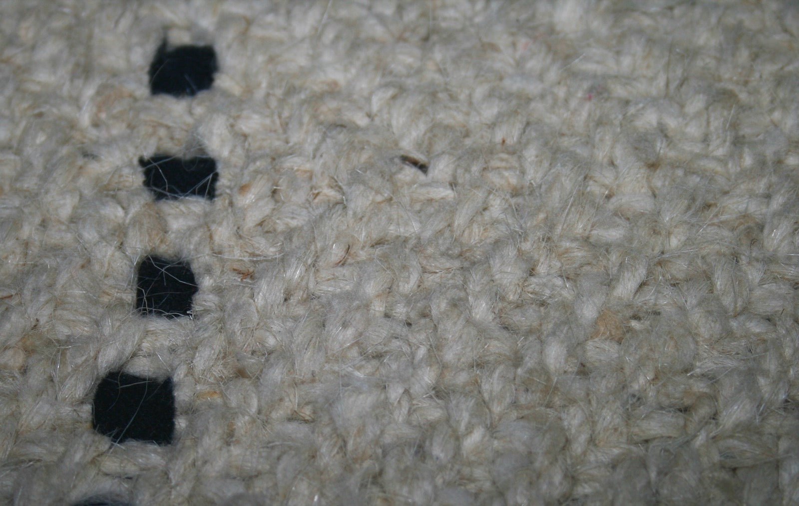 Close-up of a blanket showing diagonal twill weave ribs.