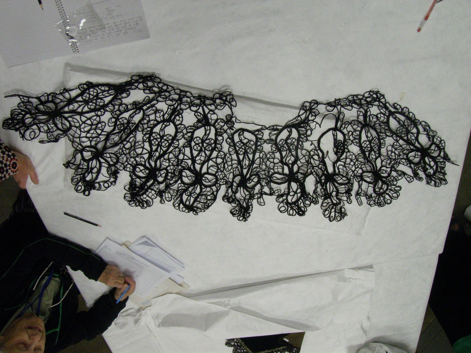 Decorative woven trim sample with tubular cord edges for upholstery.