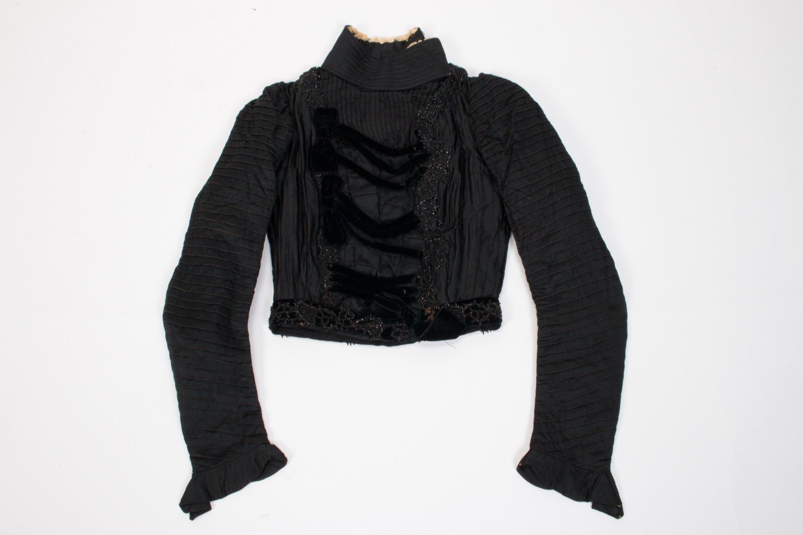 Dress with front strap at bodice shoulder panel.