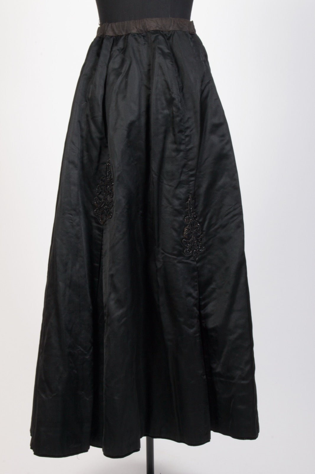 Dress with thin spaghetti straps at shoulder seam.